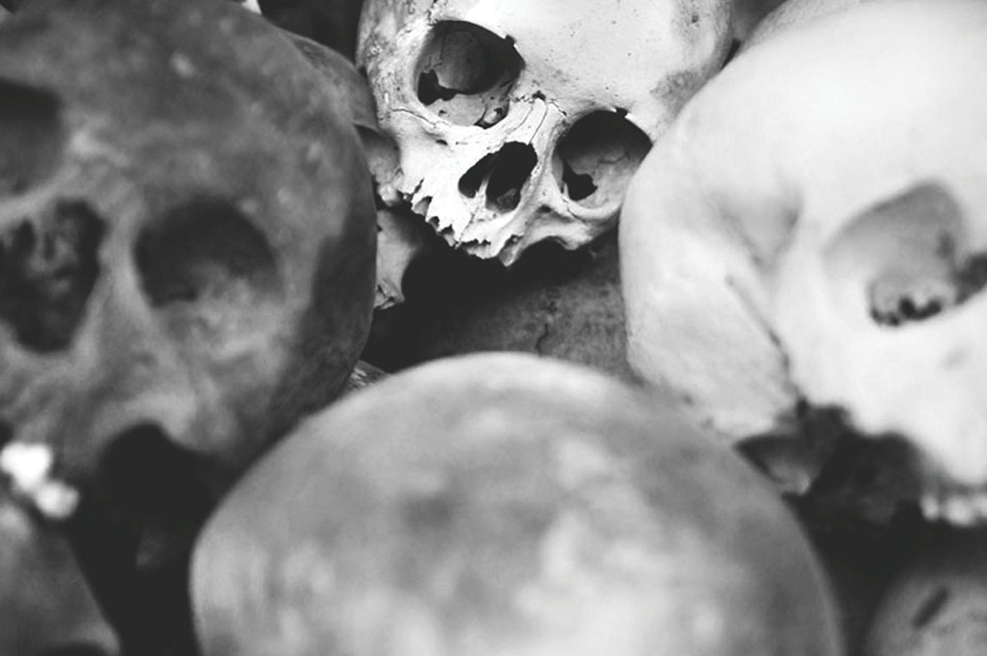 Stacks of three million skulls stand in a tower outside of Phnom Pen in a memorial for those who were murdered by Pol Pot and the Khmer Rouge in 1979. Cambodia 2011. | photo by Joshua Zirschky